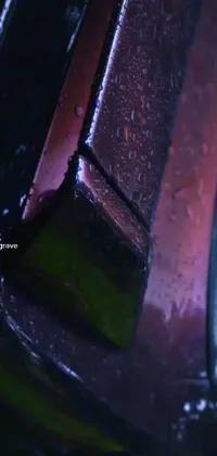 Transform your phone with this stunning live wallpaper of a car in the rain