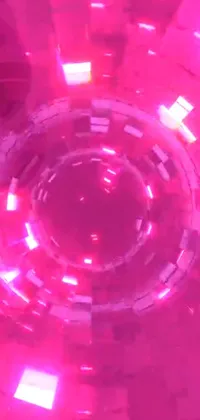 Enjoy this vibrant and dynamic live wallpaper featuring a mesmerizing pink disco ball sitting atop a table illuminated by red LEDs