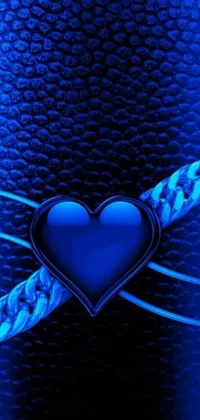 This blue heart phone live wallpaper depicts a beautiful heart shape against a deep blue background