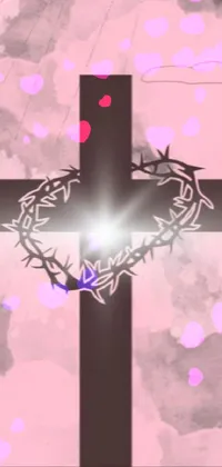This stunning phone live wallpaper depicts a crown of thorns and cross, with a beautiful pink light illuminating the design against a dark background