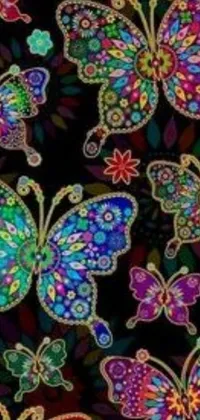 This stunning live wallpaper features a beautiful collection of colorful butterflies against a black background, inspired by intricate patterns such as paisley filigree, jacqueline embroidery and mandala motifs