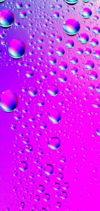 This live wallpaper features hyperrealistic water droplets on a vibrant purple and pink background