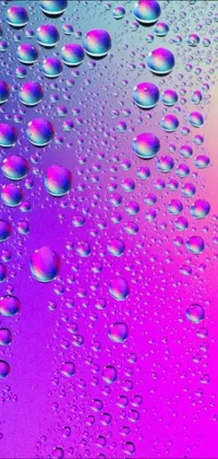 Bring a new level of fascination to your phone's screen with this live wallpaper featuring a captivating close-up shot of water droplets
