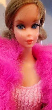 This phone live wallpaper showcases a vintage, pop art-inspired design featuring a close-up of a Barbie doll in a pink coat