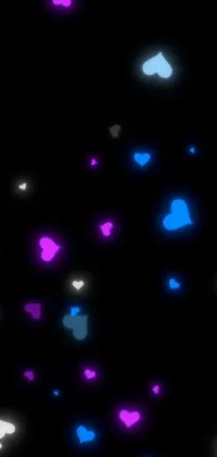 This live wallpaper boasts a gorgeous display of blue and pink hearts set against a black background