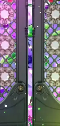 Enhance the look of your phone with this stunning live wallpaper featuring beautifully designed double doors embellished with holographic accents