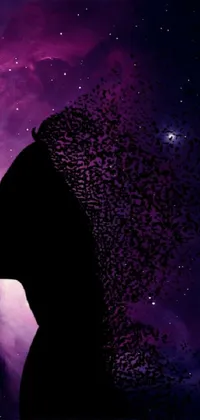 This striking phone live wallpaper features a cosmic profile portrait of a powerful feminine silhouette set against a nebula background