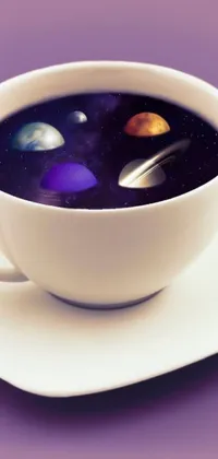 This stunning live wallpaper for your phone features a cup filled with liquid sitting on a saucer, surrounded by space art that includes five rotating planets in shades of purple