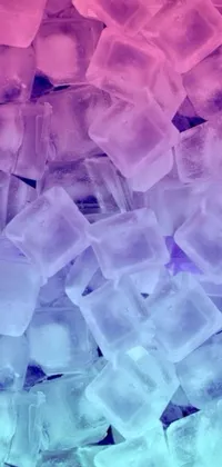 This phone live wallpaper showcases a captivating scene of a pile of ice cubes sitting on a table beside a window with a purple frame