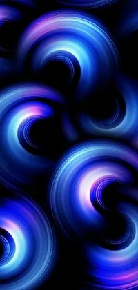 Looking for a captivating live wallpaper for your phone? Check out this stunning digital art design by Jan Rustem! Against a black background, blue and purple swirls blend together in a seamless display of smooth round shapes