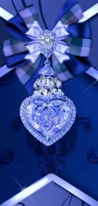 This stunning live wallpaper features a diamond heart ornament hanging from a ribbon with an icy sapphire blue color palette