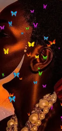 This mobile wallpaper features a stunning painting of a woman with multicolored butterflies covering her face