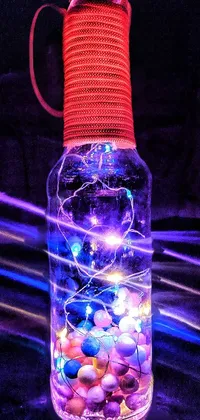 This phone live wallpaper features a glowing bottle with colorful lights inside, accompanied by a portrait