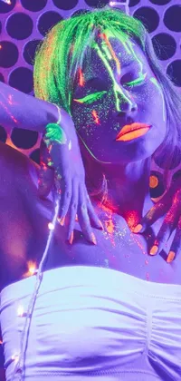 Get ready to spice up your phone's look with our mesmerizing live wallpaper! The focus of the artwork is a woman sporting green hair and striking neon makeup