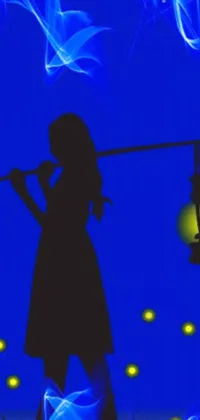 This phone live wallpaper features a stunning silhouette of a woman standing in a grassy field, holding a blue night lamp