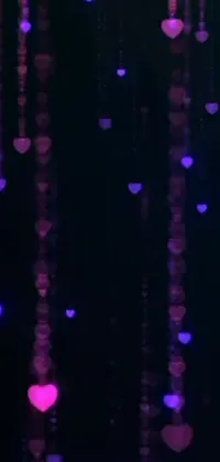 Bring your phone screen to life with this adorably whimsical live wallpaper featuring a floating collection of hearts suspended from the ceiling