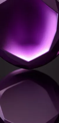 This phone live wallpaper features a stunning purple diamond resting atop a black surface
