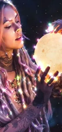 This vibrant phone live wallpaper features an alluring woman with mesmerizing dreadlocks holding a glowing moon amidst a backdrop of crystal lights
