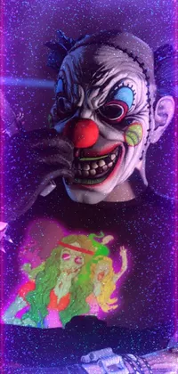 This phone live wallpaper showcases a stunning clown mask close up with intricate details and a vibrant airbrush painting look