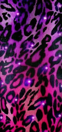Looking for a bold and striking live wallpaper for your phone? Look no further than this stunning design! Featuring a purple and black leopard print on a gorgeous purple background, this wallpaper is for those who want to make a statement