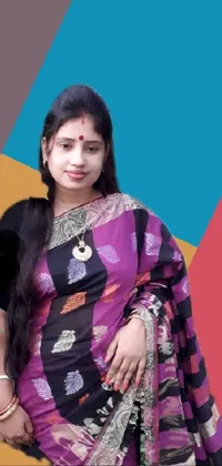 Add a vibrant touch of culture to your phone's screen with this live wallpaper of a woman posing in a beautiful sari