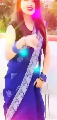 This dazzling phone live wallpaper showcases a stunning woman in a vibrant sari posing for a photo shoot