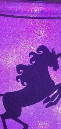 This phone live wallpaper showcases a striking purple jar with a magnificent silhouette of a unicorn