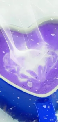 This beautiful live wallpaper features a heart-shaped bowl filled with purple liquid that swirls and pulsates in dynamic movement
