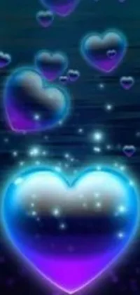 This phone live wallpaper features a beautiful blue and purple heart encircled by bubbles, against a background of twinkling blue fireflies