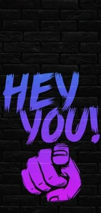 This mesmerizing live phone wallpaper features a brick wall with the phrase "hey you," coupled with an album cover and dazzling graffiti