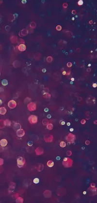 This phone live wallpaper boasts an exquisite display of bubbles in varying forms, sizes, and colors gliding graciously across the screen