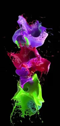 This live wallpaper boasts stunning digital art featuring colorful liquid splashing and swirling on a sleek black background