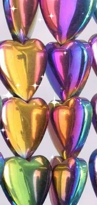 This fun phone wallpaper features a bunch of heart-shaped balloons in holographic and metallic surfaces with Lisa Frank inspired colors