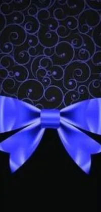 Decorate your phone screen with this stunning blue bow live wallpaper! The black background perfectly highlights the intricate details of the vector art design