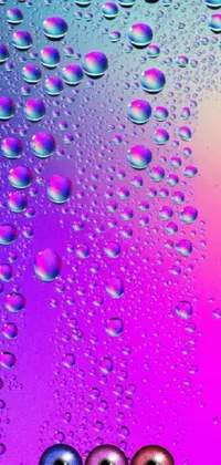 Transform your phone with this dynamic live wallpaper featuring a mesmerizing, close-up view of water droplets on a window