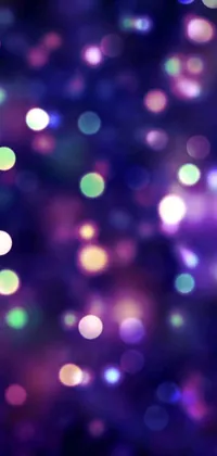 This phone live wallpaper features a captivating close-up view of colorful lights against a dark background
