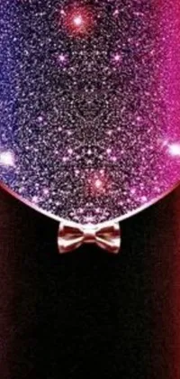 Get mesmerized by the beautiful live wallpaper for your phone featuring a heart-shaped balloon with a bow tie perfect for making your phone look dreamy and romantic