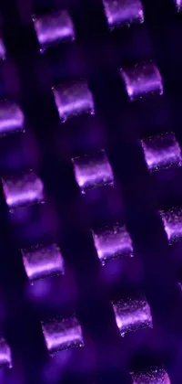 This phone live wallpaper boasts a stunning display of purple lights arranged in a pattern, emitting a gentle and mesmerizing glow that changes as the phone moves