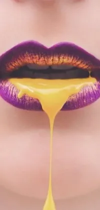 This live phone wallpaper is a seductive take on a person's mouth and lips, with a pop art inspired aesthetic