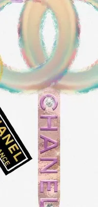 This phone live wallpaper features a stunning design with the iconic Chanel logo at the center, surrounded by an ankh symbol, shimmering crystals, and a holographic effect