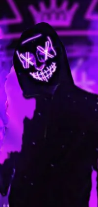 This captivating phone live wallpaper boasts a cyberpunk art scene with a mysterious man in a hoodie and ghost mask standing in front of a neon sign