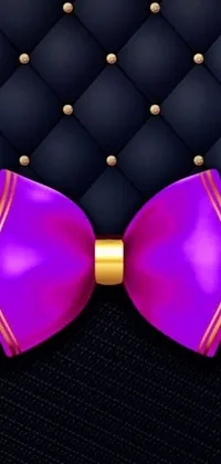 This phone live wallpaper boasts a classy purple and gold bow tie beautifully crafted on a black background