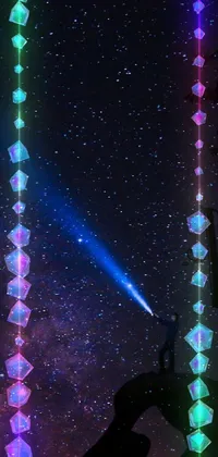 This live wallpaper features a mesmerizing depiction of a blue light held in someone's hand against the background of an enchanting space scene