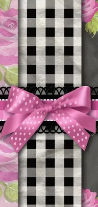 This live wallpaper features a black and white checkered background with pink roses and wide ribbons