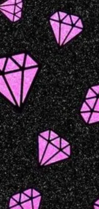 Introducing a trendy and fashionable phone live wallpaper featuring animated pink diamonds on a black speckled background