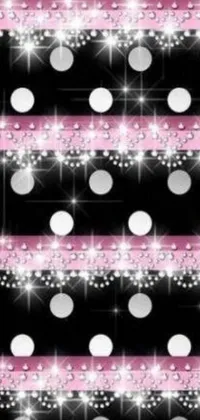 This live wallpaper features a pink and white polka dot pattern set on a black background