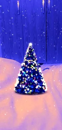 This phone live wallpaper features a charming claymation style Christmas tree sitting on a snow-covered ground, with falling snowflakes and decorative twinkling lights