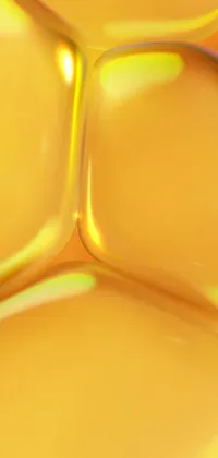 This stunning live wallpaper for your mobile phone showcases a close-up view of a vibrant yellow liquid substance, created through advanced digital art techniques