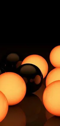 Introducing a vibrant phone live wallpaper featuring a bunch of balls sitting atop a table