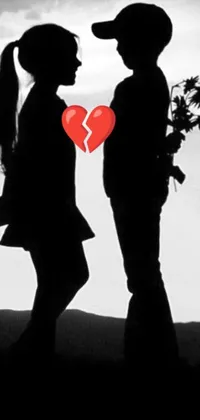 This live wallpaper features a romantic couple standing together with a broken heart separating them